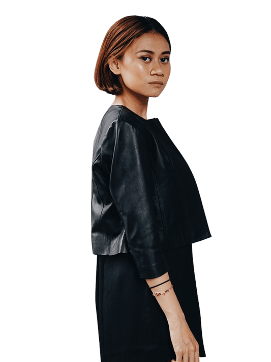 Seminyak leather Bali has many leather products that are very salable in the market. One of them is the Alexa crop jacket currently worn by a short-haired model with a serious face. This pose is perfect for a leather jacket whose design looks firm. Combined with a black inner long dress, the alexa crop jacket looks more stylish. When viewed from the side, the jacket follow the curves of the body perfectly. So don't be afraid that the jacket will look too big from the side.
