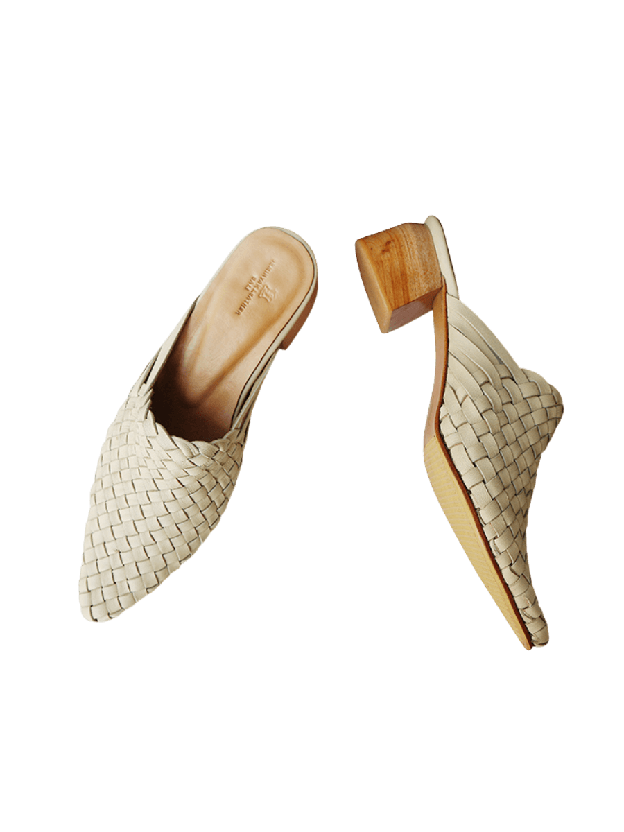 Cream ivory pointy woven heels with diagonal cut heels. Woven leather upper for a custom fit. 5 cm height. A blend of modern elegance and artisanal craftsmanship.