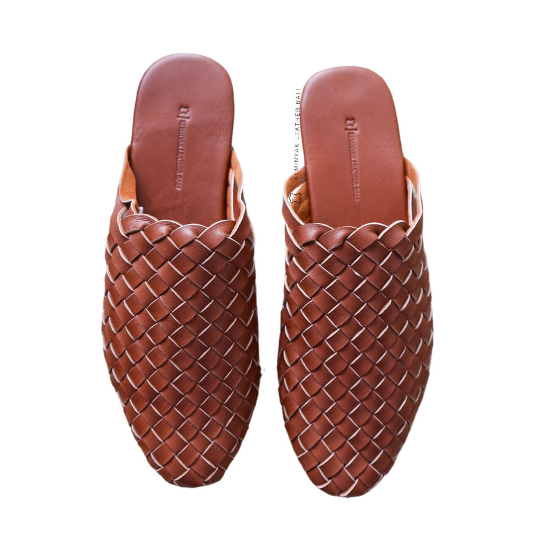 A pair of Summer Tan woven mules  displayed against a white background designs by Seminyak Leather Bali