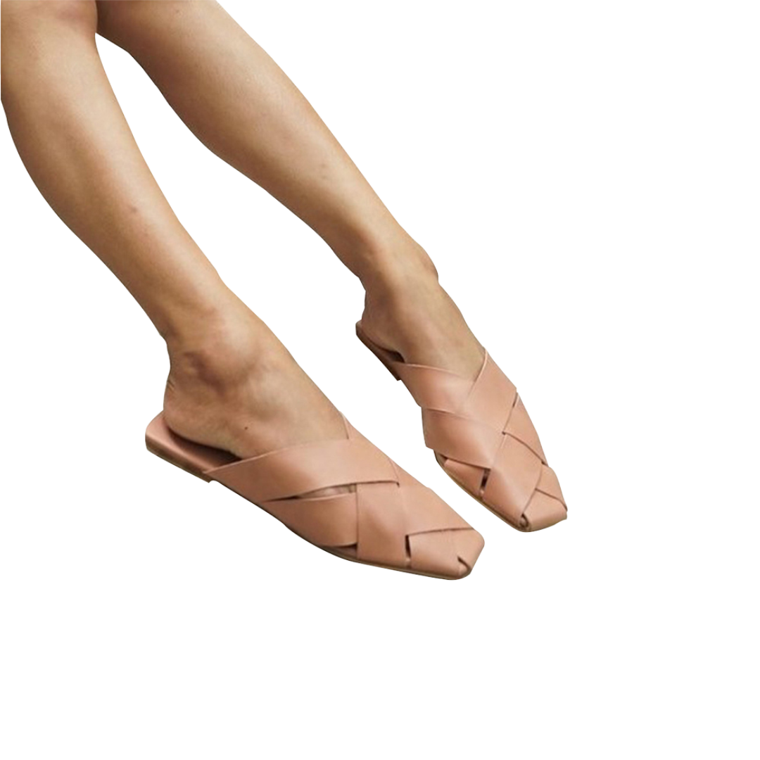 A pair of blush square toe mules  displayed against a white background designs by Seminyak Leather Bali