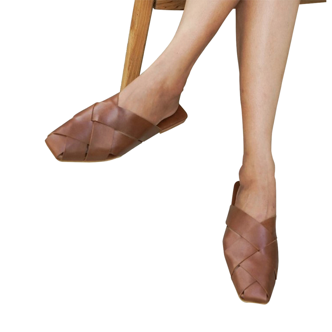 A pair of summer tan square toe mules  displayed against a white background designs by Seminyak Leather Bali