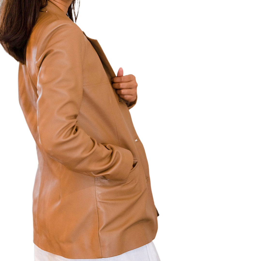 Tan leather blazer worn by a person on a white background designs by Seminyak Leather Bali
