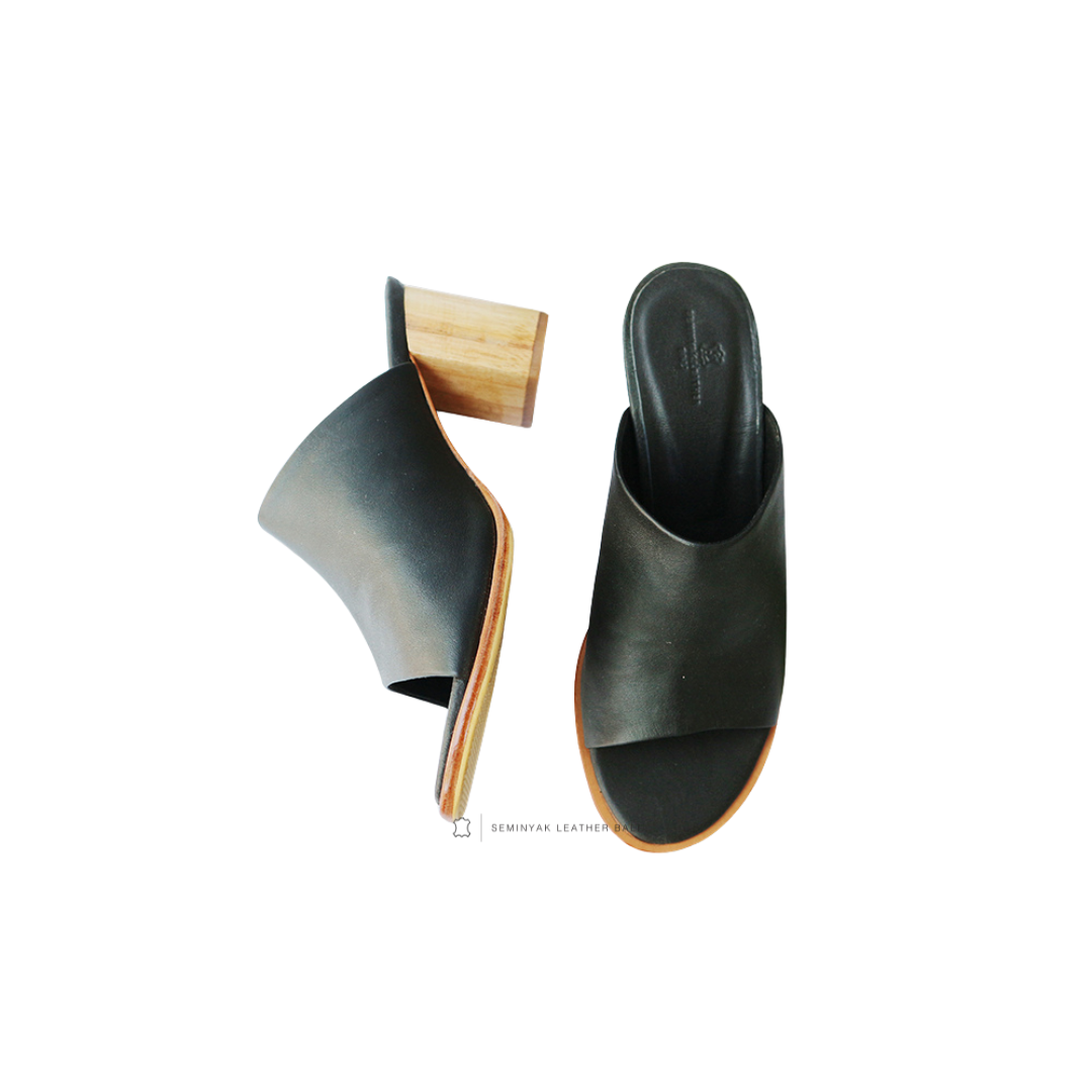 A pair of black mule heels with wooden leather heels and wide straps designs by Seminyak Leather Bali