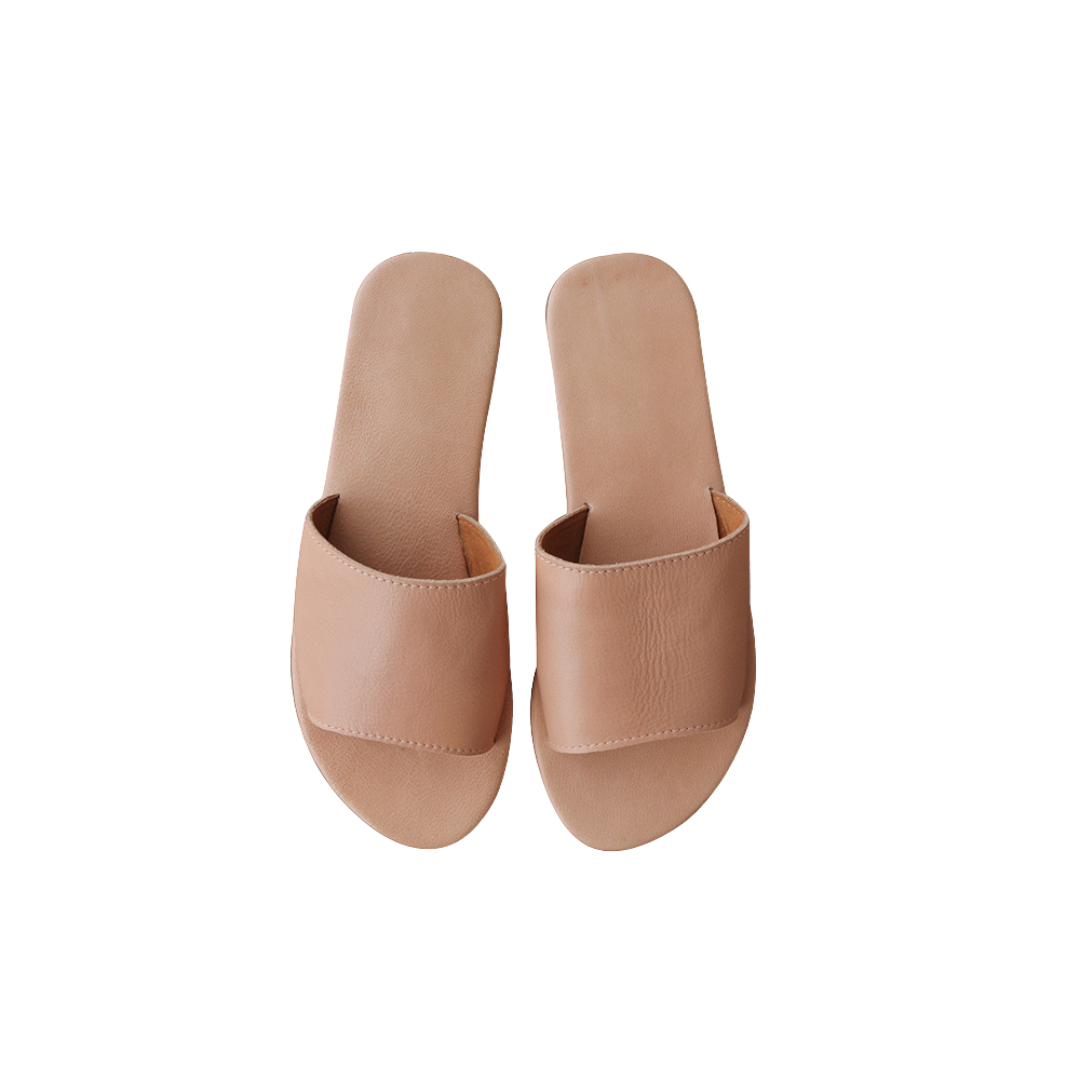 A pair of blush genuine goat leather slides with a wide strap designs by Seminyak Leather Bali