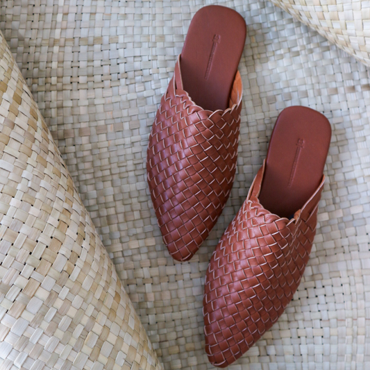 dark brown leather woven mules upper by Seminyak Leather Bali, providing a custom fit. Leather sole with nonslip rubber comfortable steps. A blend of style and art for elevated fashion.