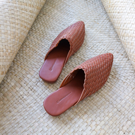 dark brown leather woven mules upper by Seminyak Leather Bali, providing a custom fit. Leather sole with nonslip rubber comfortable steps. A blend of style and art for elevated fashion.