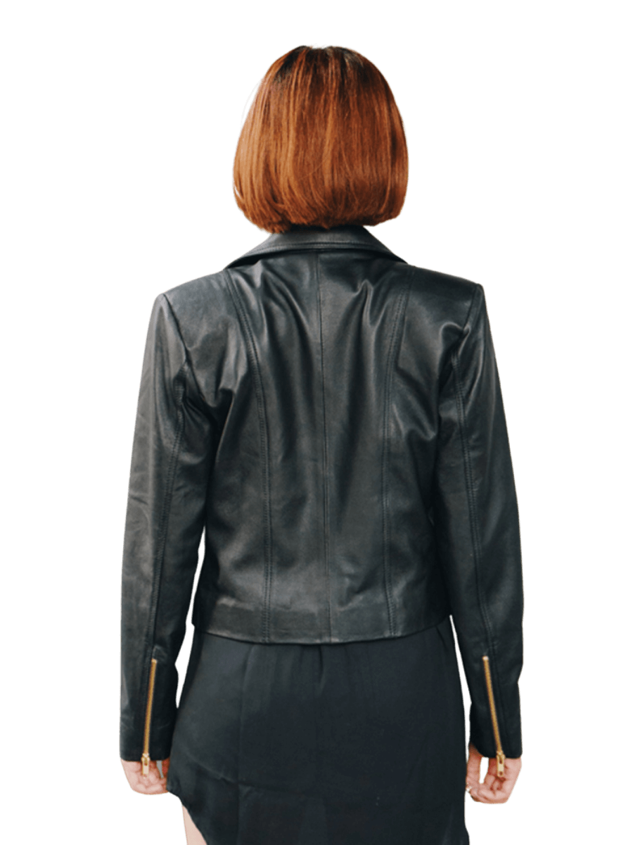 A model wearing a leather Jacket from Seminyak Leather Bali. A black leather jacket with a gold accessory shoes the back side of the Jacket. We proudly present Eliz biker leather jacket for you.