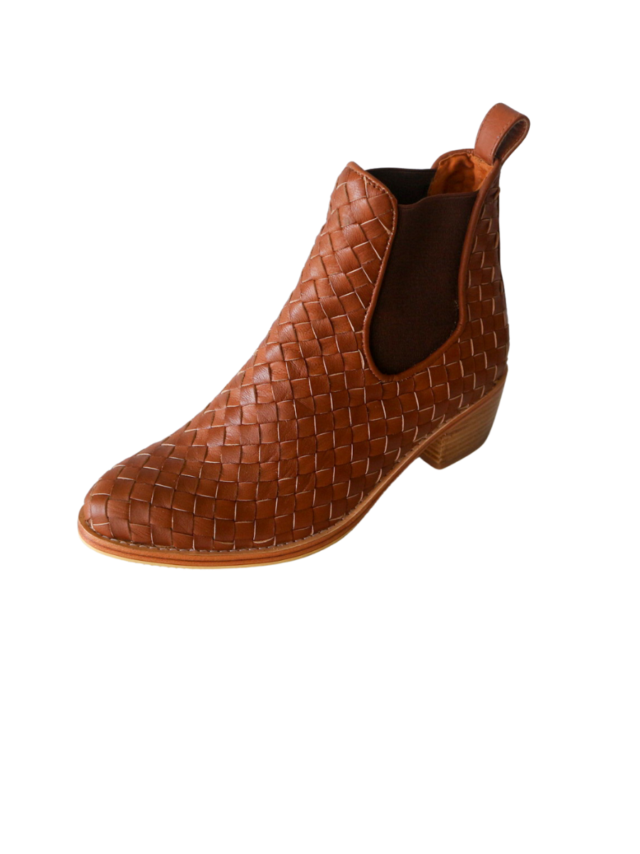 Ankle boots with brown leather woven detailing in a slim fit cut by Semminyak Leather Bali. Elastic closure with carved metal accents on toe cap and heel. 5 cm wooden heel with a rounded toe design. Stylish and sophisticated footwear with a natural finish, perfect for making a fashion statement.