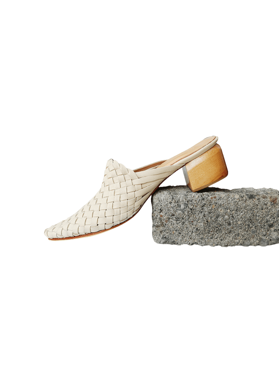 Cream ivory pointy woven heels with diagonal cut heels. Woven leather upper for a custom fit. 5 cm height. A blend of modern elegance and artisanal craftsmanship.