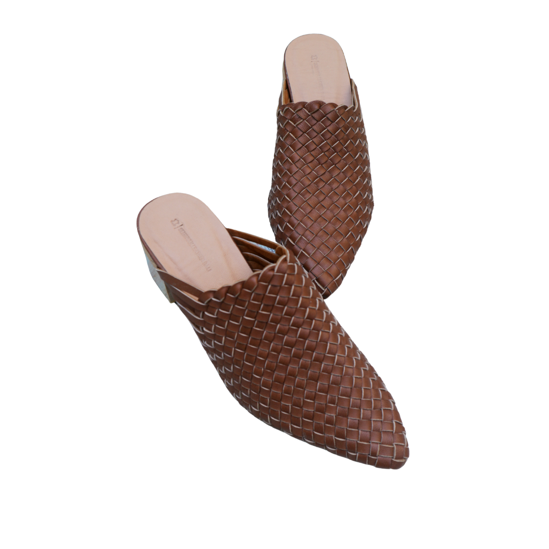 Brown pointy woven heels with diagonal cut heels. Woven leather upper for a custom fit. 5 cm height. A blend of modern elegance and artisanal craftsmanship.