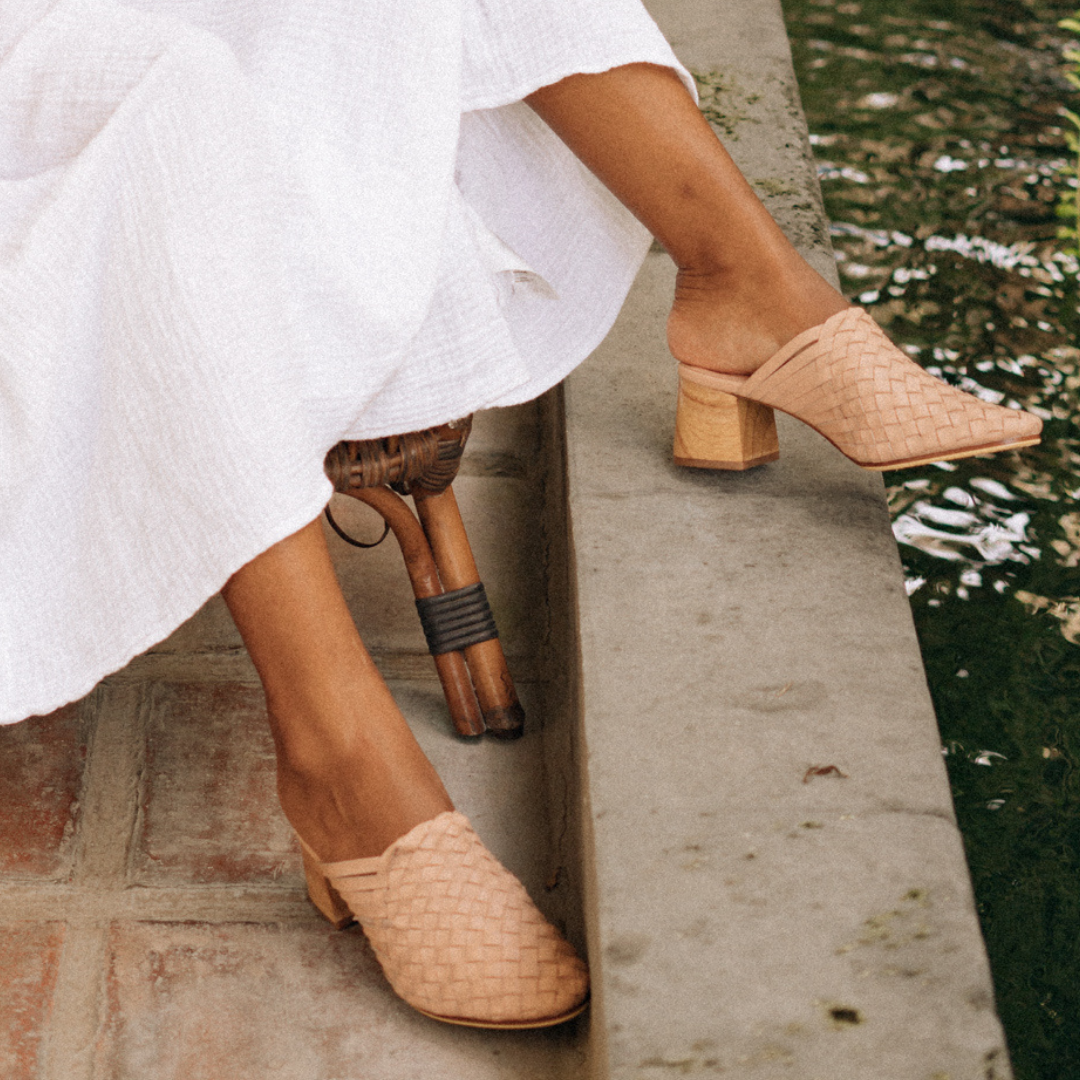Nude pink heeled mules with woven leather upper for a custom fit by Seminyak Leather Bali. 5 cm wooden block heel in a natural finish. Leather sole with nonslip rubber for confident and comfortable steps.
