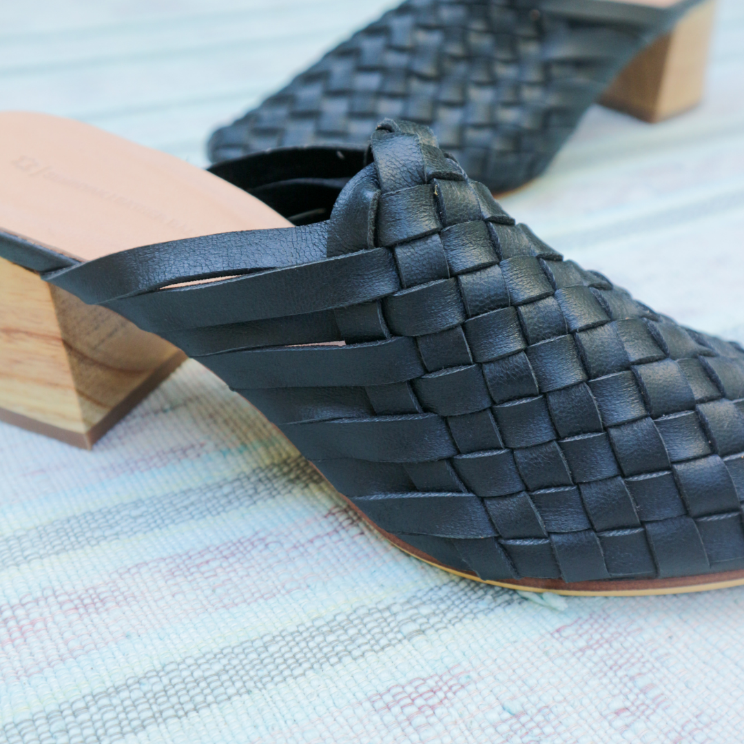 Black heeled mules with woven leather upper for a custom fit by Seminyak Leather Bali. 5 cm wooden block heel in a natural finish. Leather sole with nonslip rubber for confident and comfortable steps.