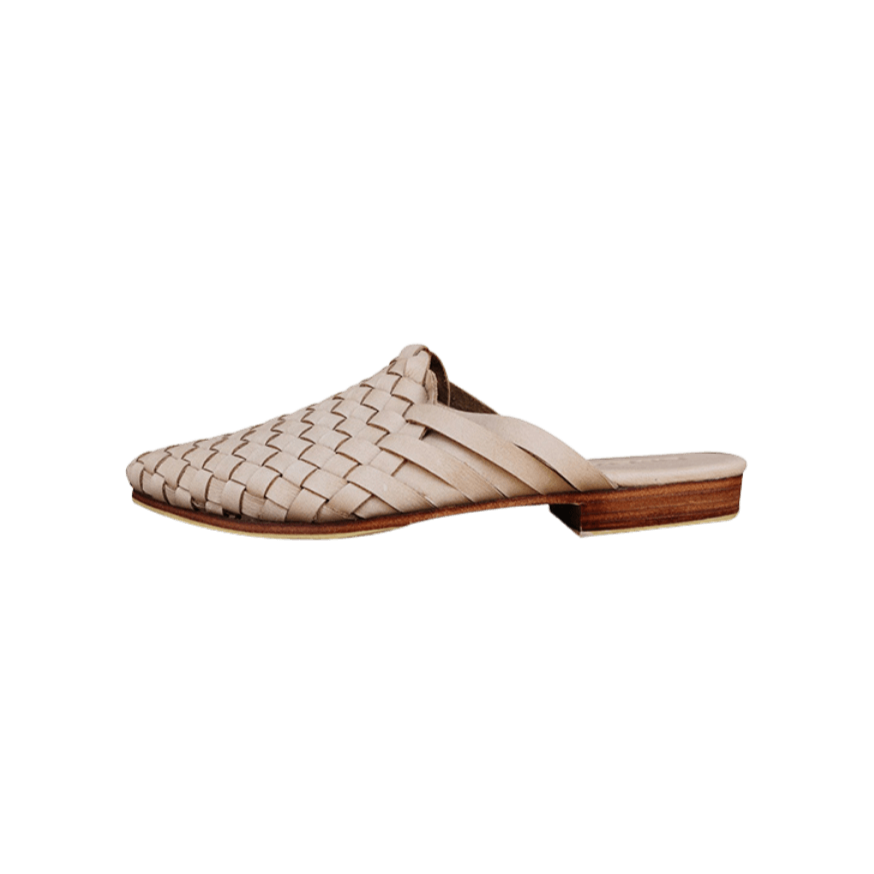 beige leather woven mules upper by Seminyak Leather Bali, providing a custom fit. Leather sole with nonslip rubber comfortable steps. A blend of style and art for elevated fashion.