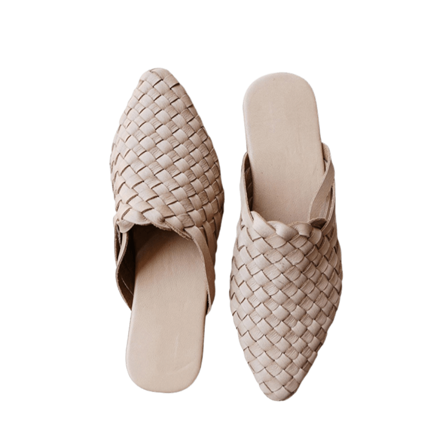 beige leather woven mules upper by Seminyak Leather Bali, providing a custom fit. Leather sole with nonslip rubber comfortable steps. A blend of style and art for elevated fashion.