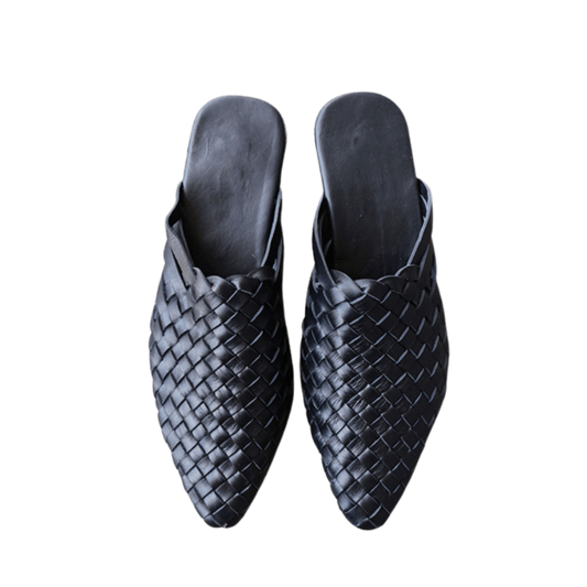 black leather woven mules upper by Seminyak Leather Bali, providing a custom fit. Leather sole with nonslip rubber comfortable steps. A blend of style and art for elevated fashion.