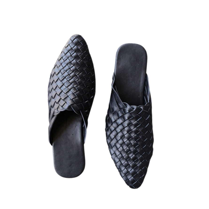 black leather woven mules upper by Seminyak Leather Bali, providing a custom fit. Leather sole with nonslip rubber comfortable steps. A blend of style and art for elevated fashion.