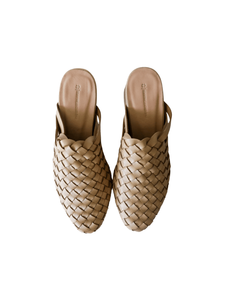 Cream beige heeled mules with woven leather upper for a custom fit by Seminyak Leather Bali. 5 cm wooden block heel in a natural finish. Leather sole with nonslip rubber for confident and comfortable steps.