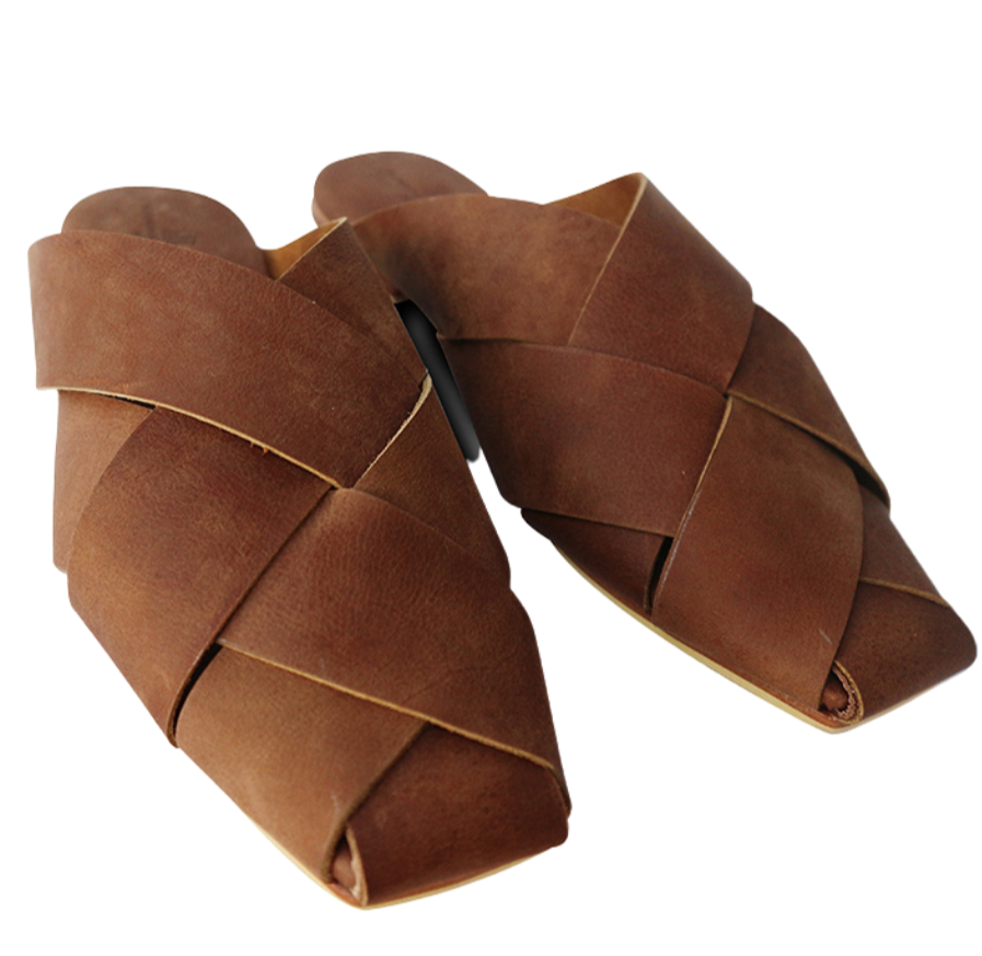 Antique brown leather mules with wide woven leather upper by Seminyak Leather Bali, providing a custom fit. Leather sole with nonslip rubber for confident steps. A blend of style and comfort for elevated fashion.